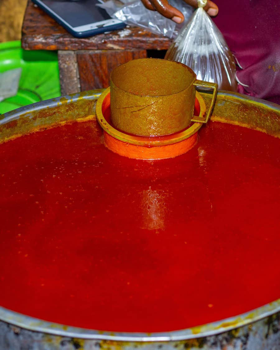 Red palm oil in a large drum